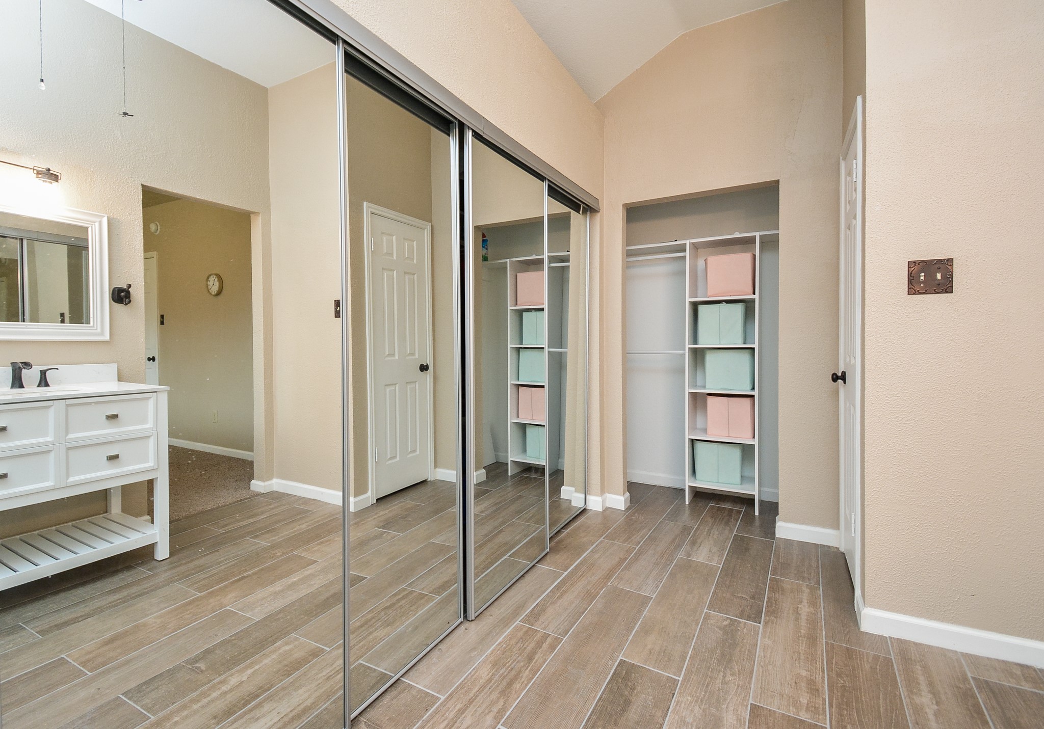 23734 Canyon Lake Drive Spring, TX 77373 - Photo 20 of 32 a view of a walk in closet and bedroom with wooden floor