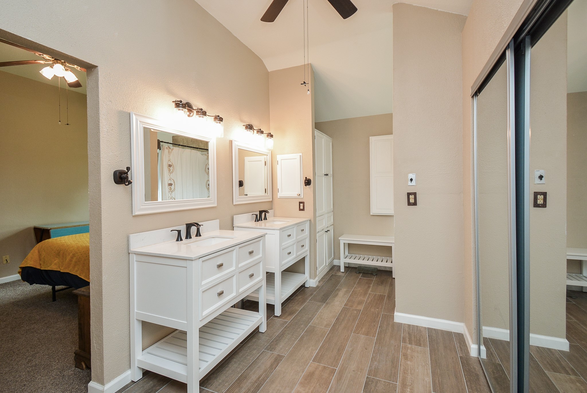23734 Canyon Lake Drive Spring, TX 77373 - Photo 21 of 32 a bathroom with a double vanity sink a mirror and a shower