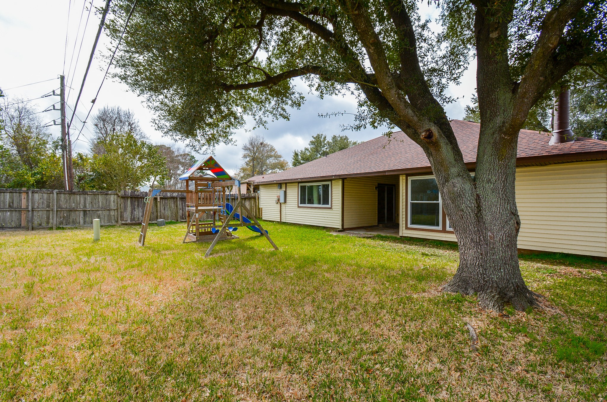 23734 Canyon Lake Drive Spring, TX 77373 - Photo 31 of 32 a view of a house with swimming pool and a yard