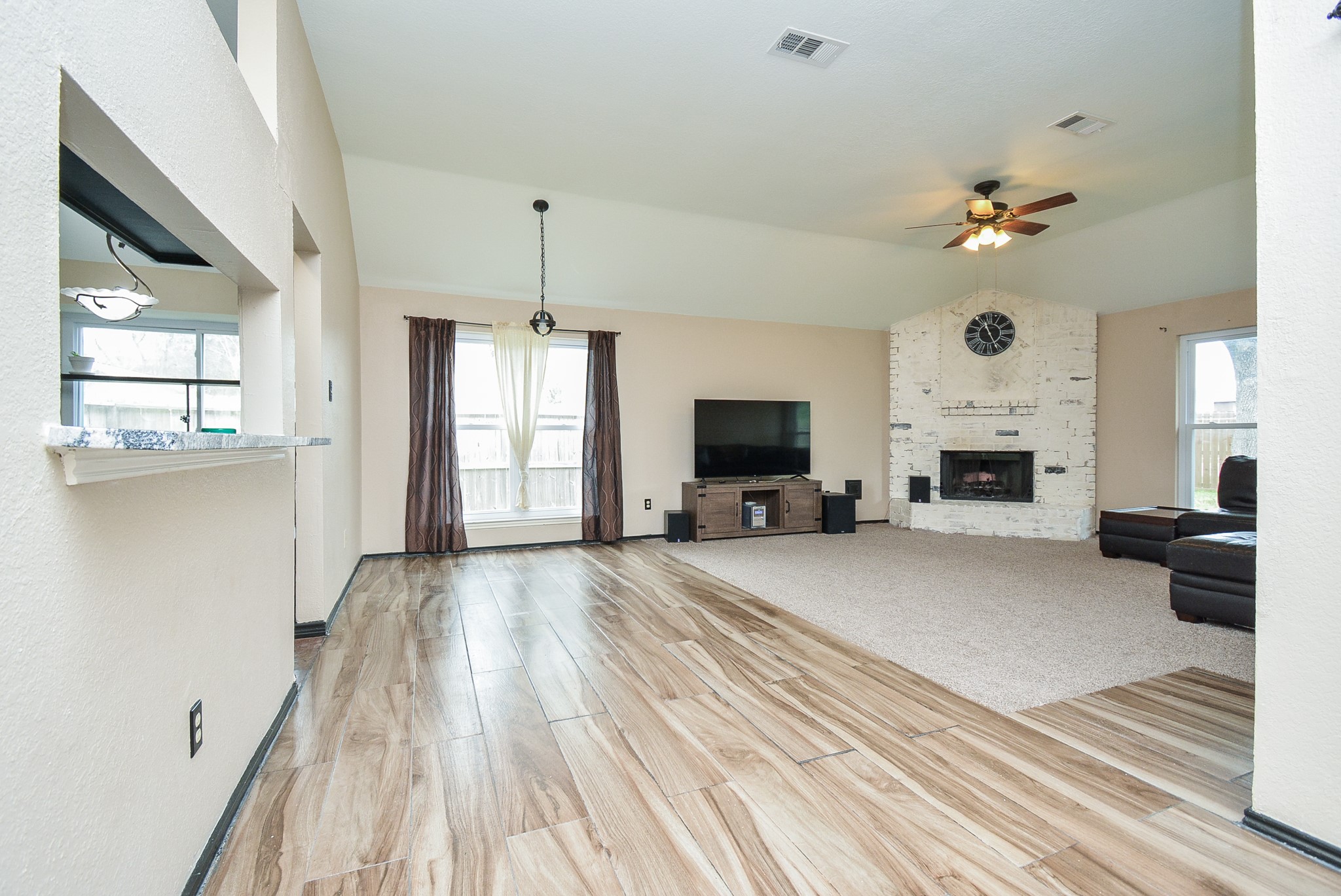 23734 Canyon Lake Drive Spring, TX 77373 - Photo 6 of 32 a living room with furniture fireplace and flat screen tv
