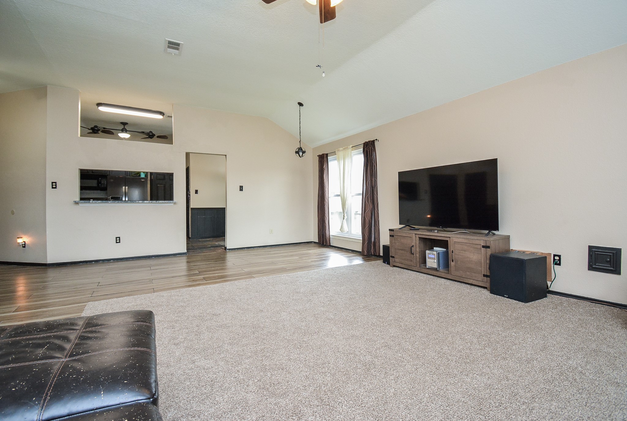 23734 Canyon Lake Drive Spring, TX 77373 - Photo 9 of 32 a living room with furniture and a flat screen tv