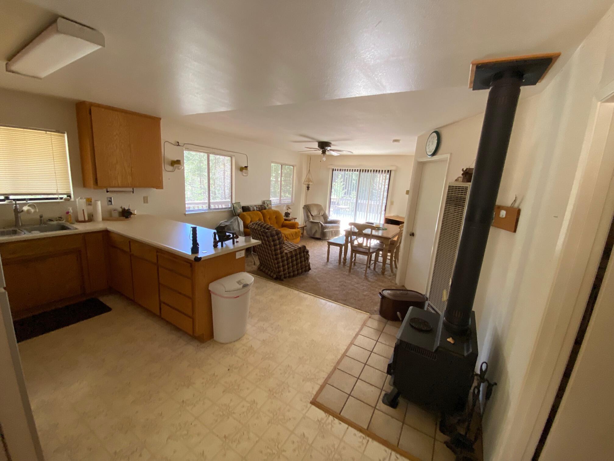 581 Mountain Aire Road Trinity Center, CA 96091 - Photo 6 of 48 Kitchen, living and dining area with wood stove