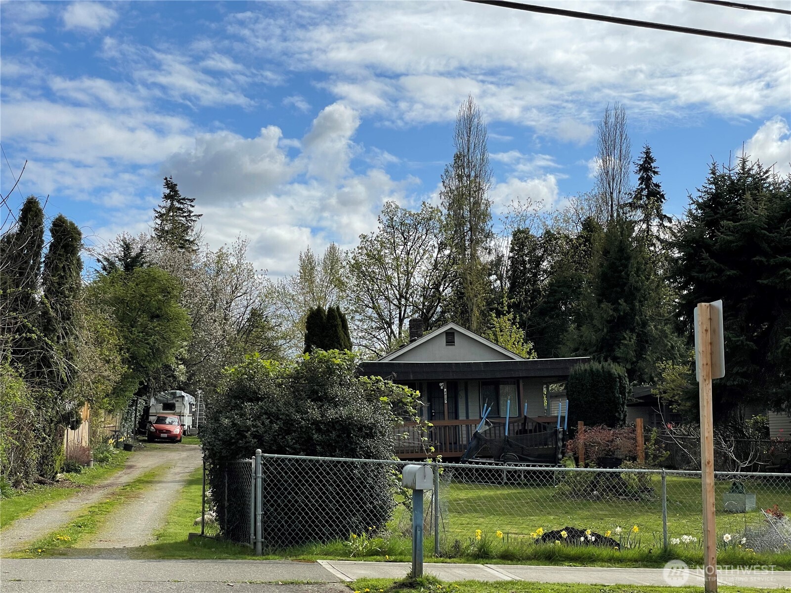 6625 South 124th Street Seattle, WA 98178 - Photo 1 of 3 a front view of a house with garden