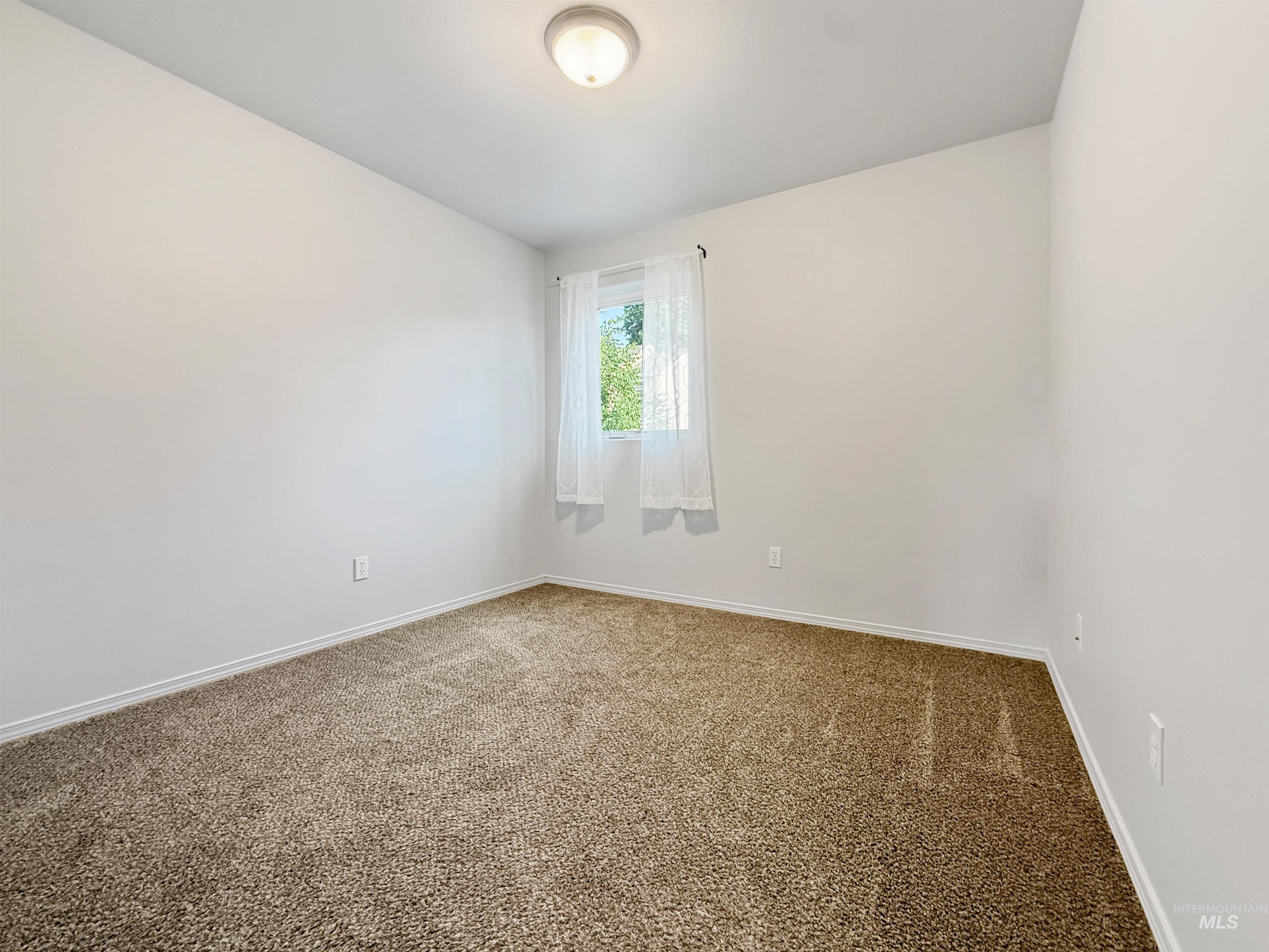 1354 Bristol Road Moscow, ID 83843 - Photo 13 of 19 Neutral-toned carpeting and light wall paint define this interior space