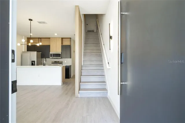 a view of a kitchen from the hallway
