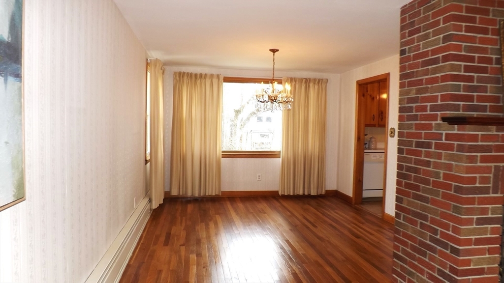 48 Ernest Avenue Worcester, MA 01604 - Photo 16 of 41 a view of a room with wooden floor and door