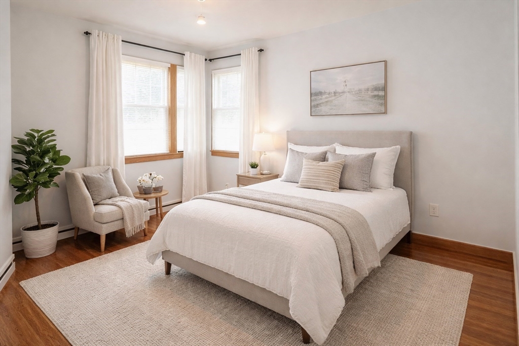 48 Ernest Avenue Worcester, MA 01604 - Photo 23 of 41 a bedroom with a bed and chair