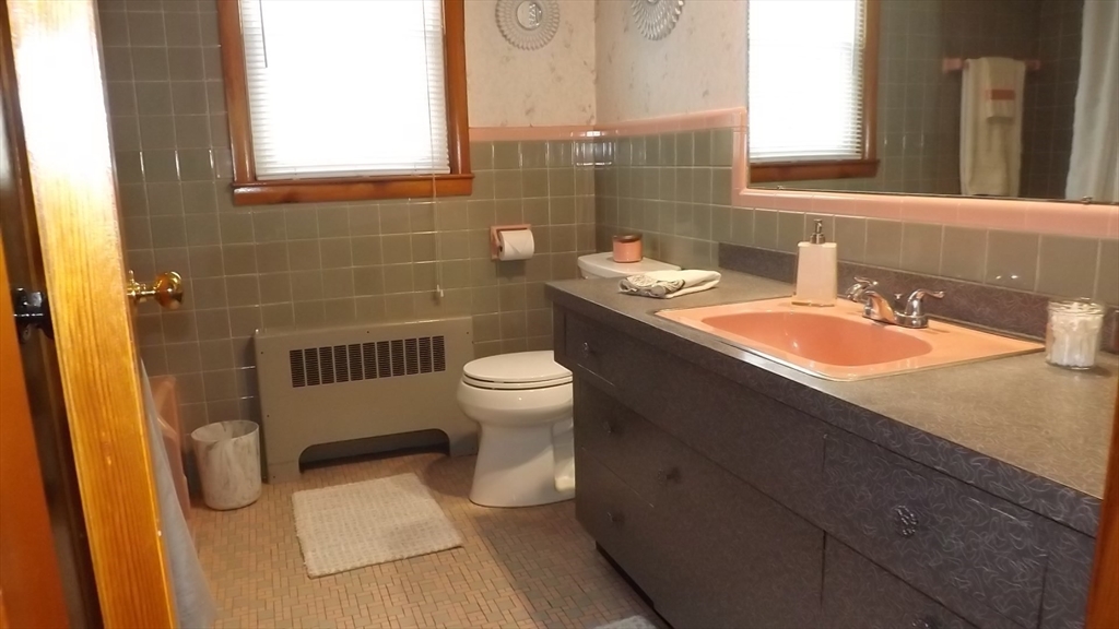 48 Ernest Avenue Worcester, MA 01604 - Photo 24 of 41 a bathroom with a sink toilet and a mirror