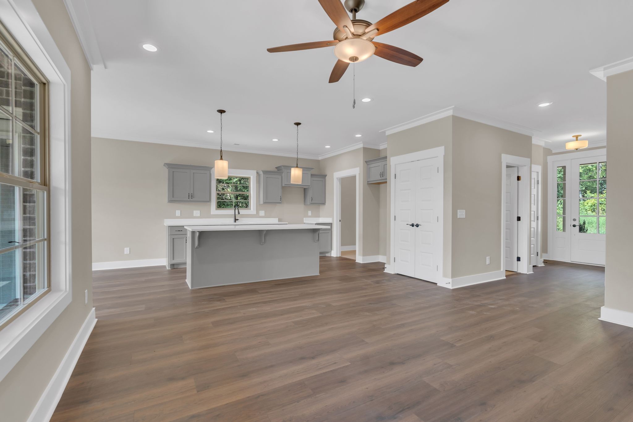 1170 Rimrock Road Smyrna, TN 37167 - Photo 9 of 33 a view of an empty room with kitchen view and wooden floor