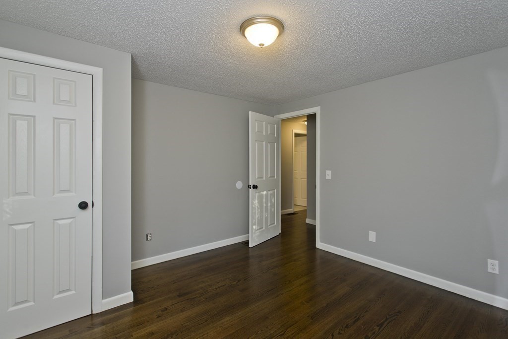 75 Saffron Circle Springfield, MA 01129 - Photo 23 of 42 a view of an empty room with wooden floor