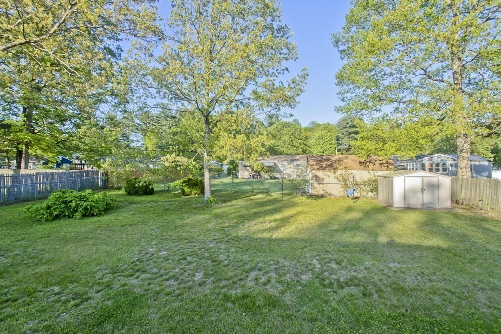 75 Saffron Circle Springfield, MA 01129 - Photo 3 of 42 a view of an house with backyard space and garden