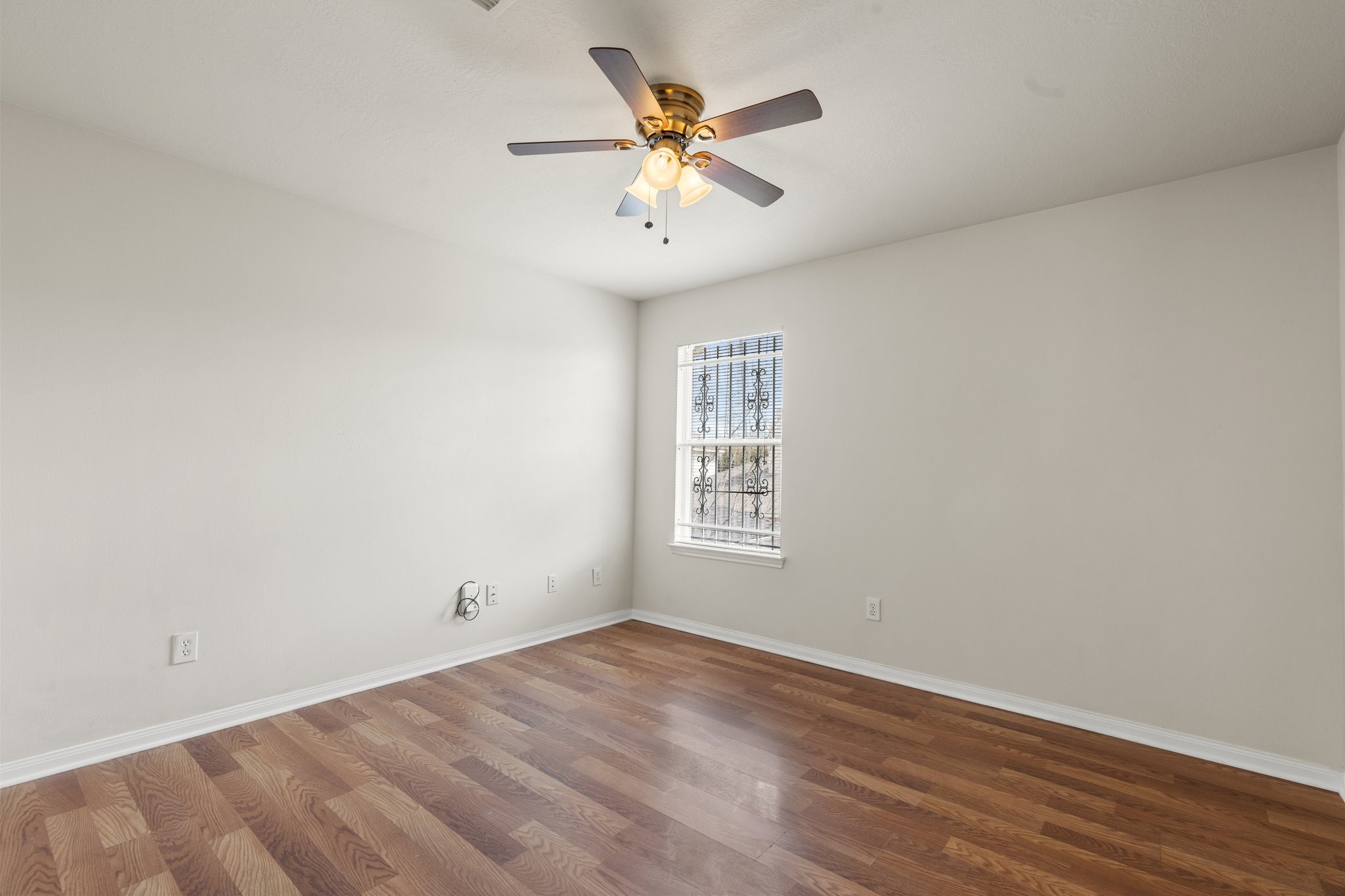 3111 Holly Ranch Drive Katy, TX 77494 - Photo 20 of 28 an empty room with wooden floor and windows