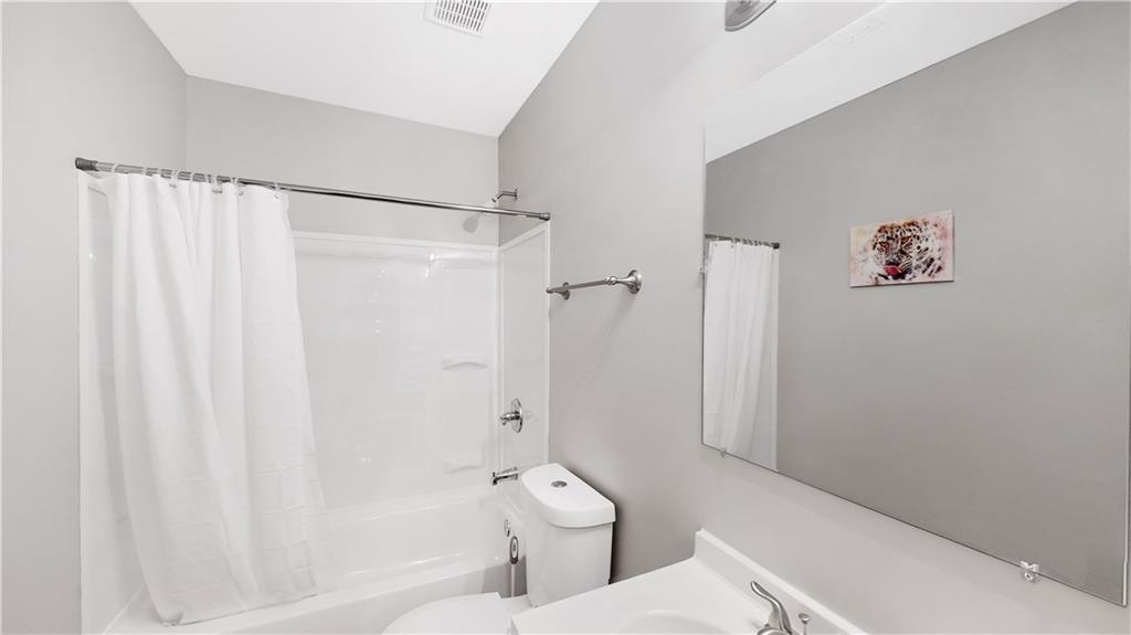 1333 Campbellton Road Southwest Atlanta, GA 30310 - Photo 14 of 21 a bathroom with a shower a toilet and a shower