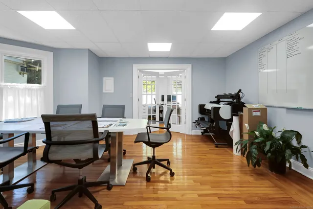 a bathroom with a sink a toilet and a window