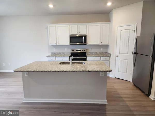a view of kitchen with wooden floor