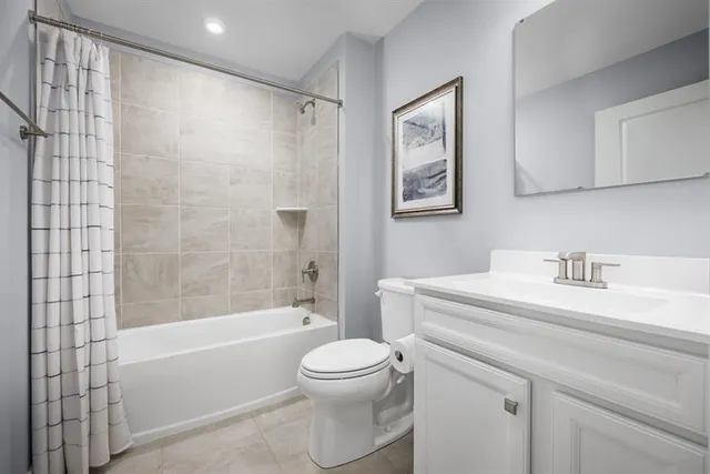 a bathroom with a sink a toilet and a bathtub