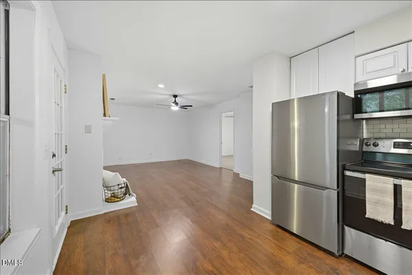 a kitchen with a refrigerator and a sink