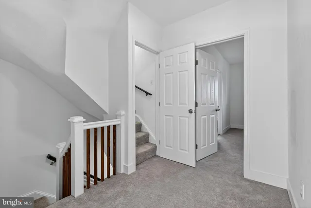 a view of a hallway with closet area