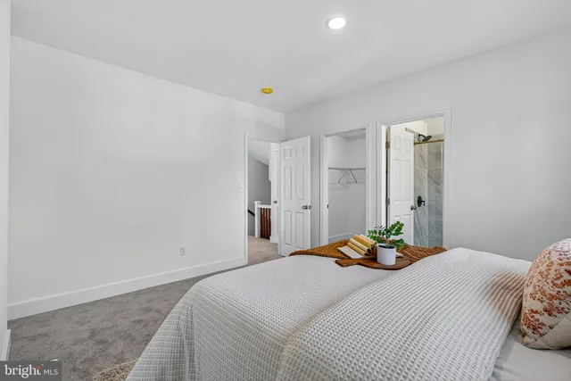 a bedroom with a bed and a table