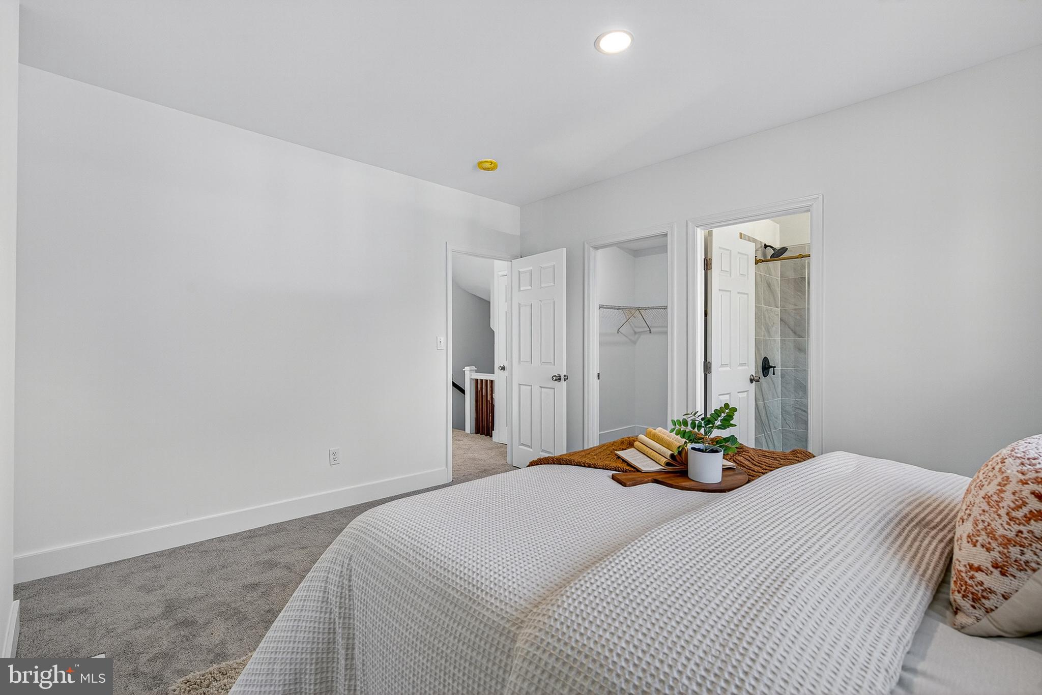 802 North Woodington Road Baltimore, MD 21229 - Photo 15 of 41 a bedroom with a bed and a table