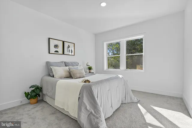 a room with a bed and a window