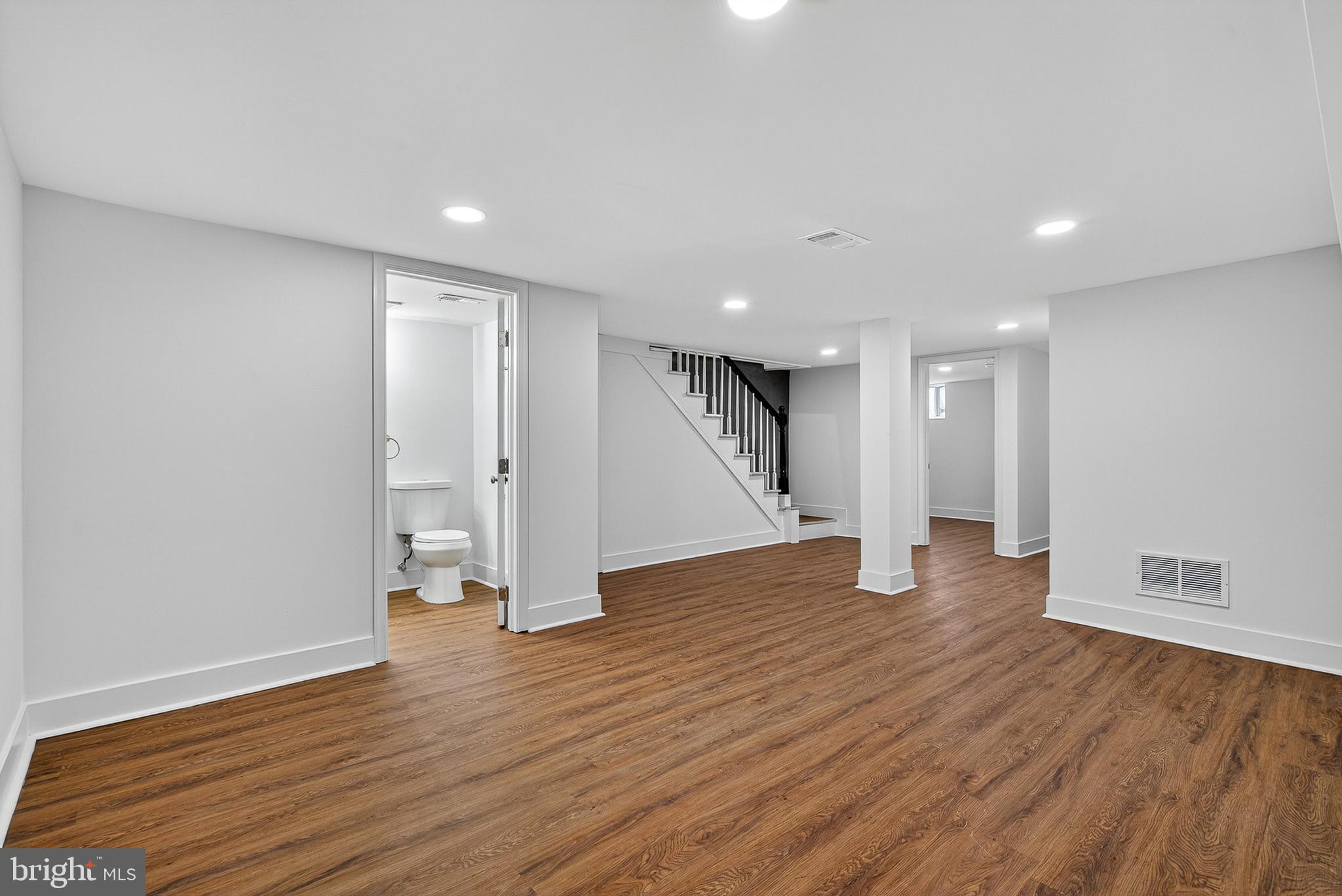 802 North Woodington Road Baltimore, MD 21229 - Photo 32 of 41 a view of empty room with wooden floor