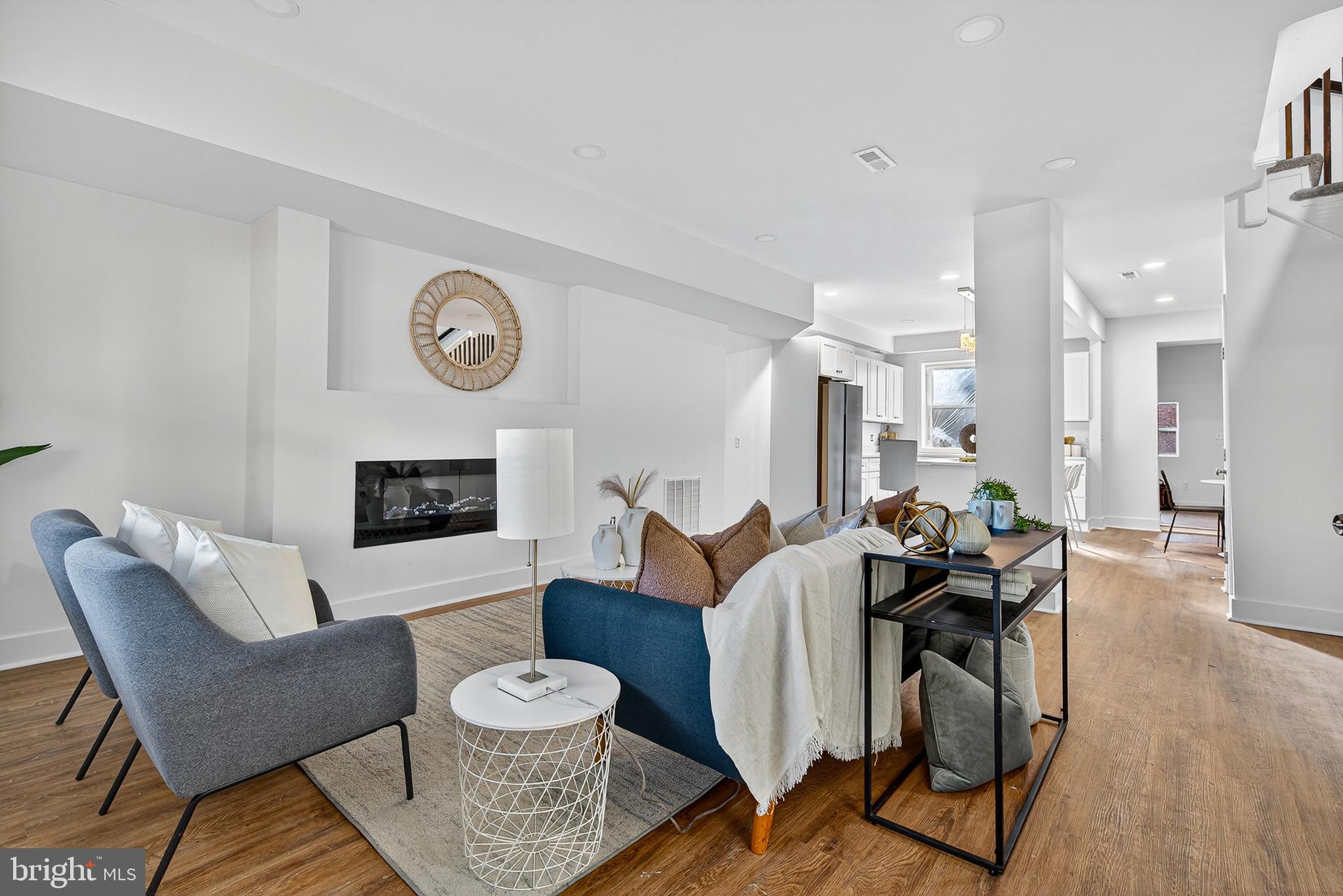 802 North Woodington Road Baltimore, MD 21229 - Photo 5 of 41 a living room with furniture and a fireplace