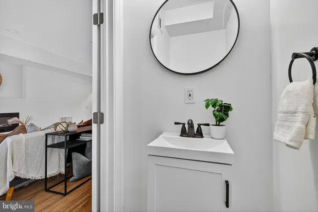 a bathroom with a sink and a mirror