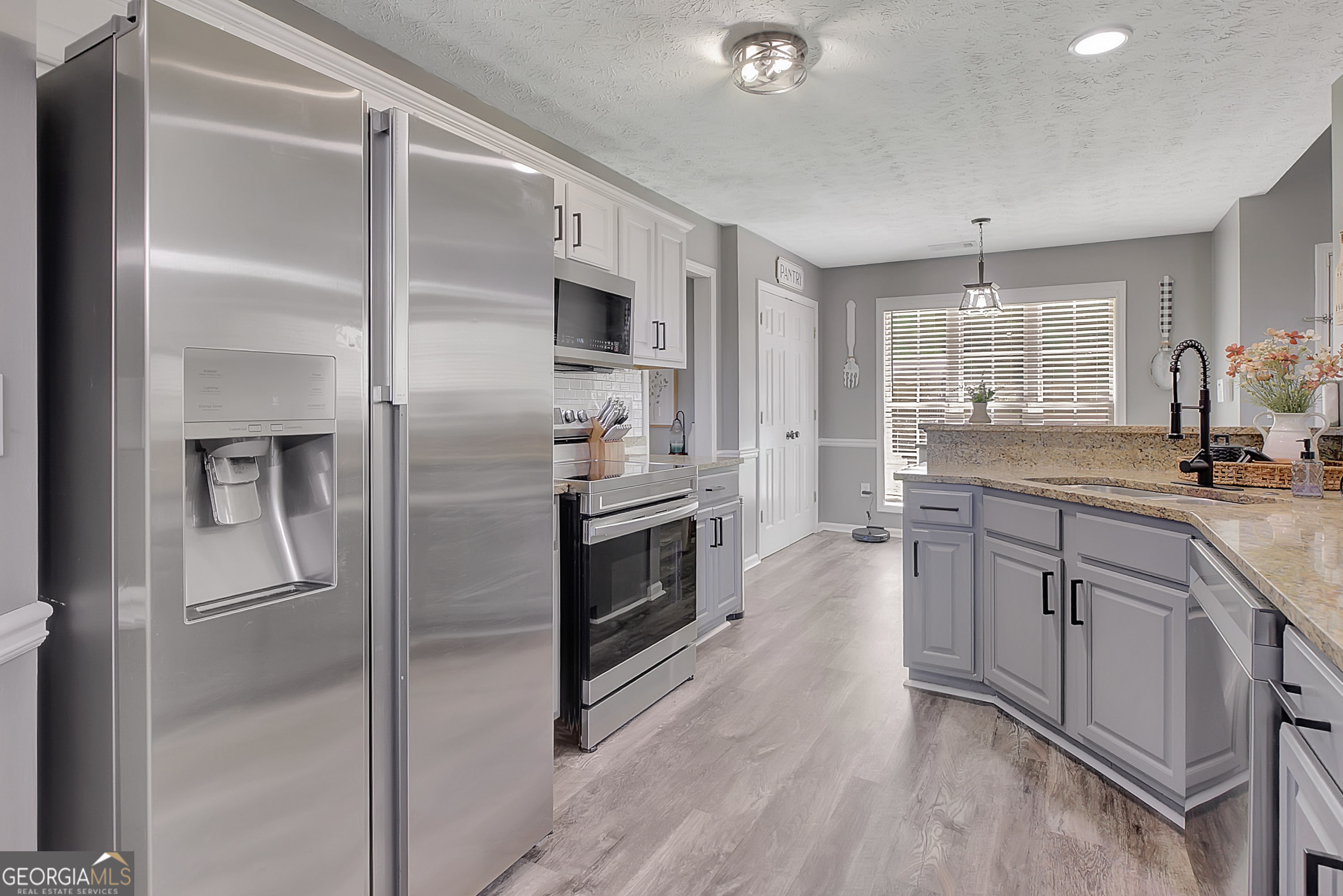 229 John Lovelace Road LaGrange, GA 30241 - Photo 32 of 59 a kitchen with stainless steel appliances a refrigerator sink and microwave