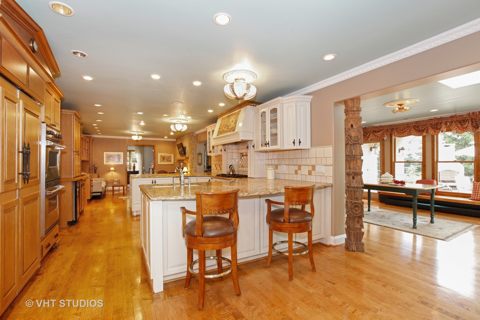 39 Mockingbird Lane Oak Brook, IL 60523 - Photo 12 of 45 a view of a dining room kitchen with furniture and a large window