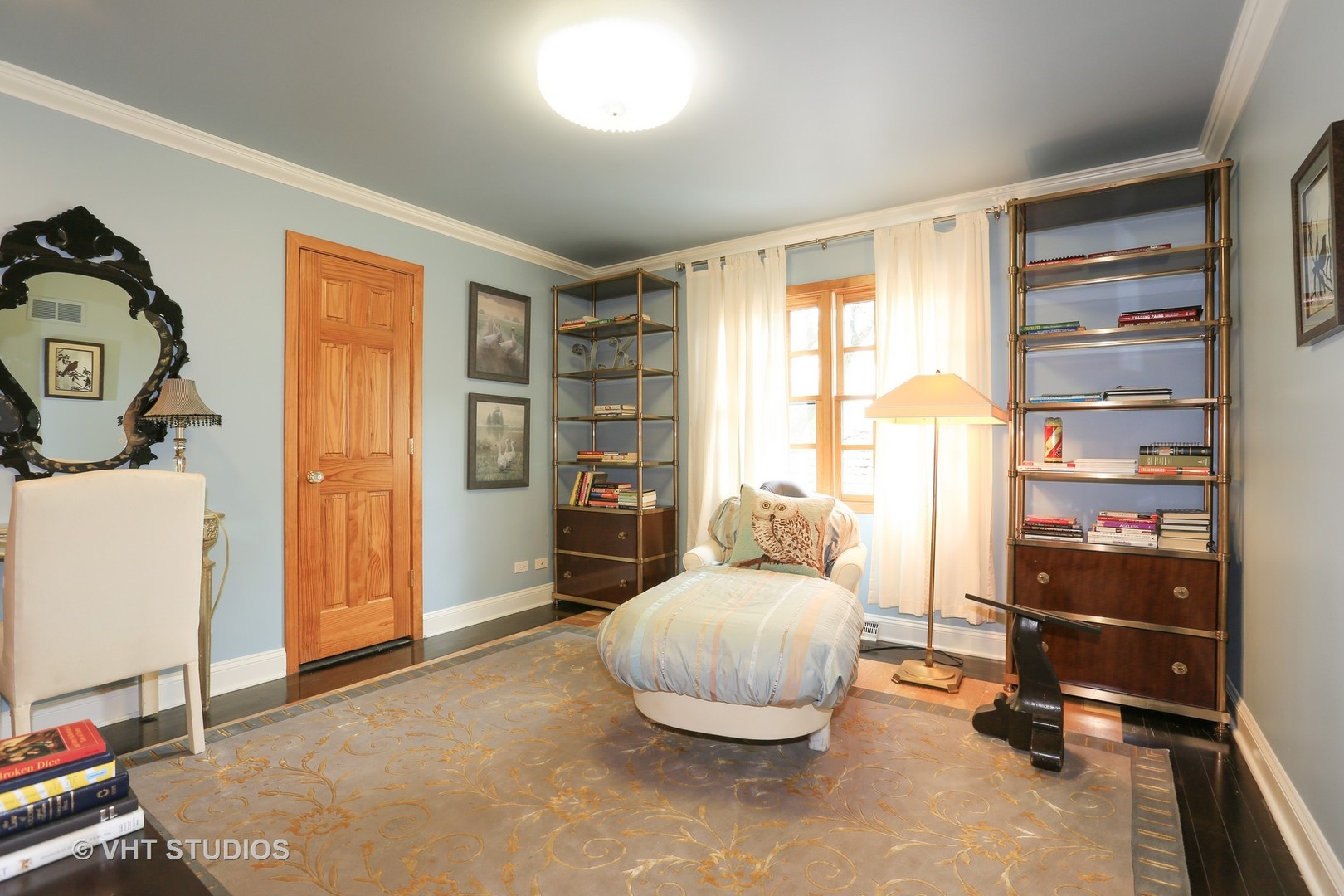39 Mockingbird Lane Oak Brook, IL 60523 - Photo 27 of 45 a living room with furniture a rug and a large window