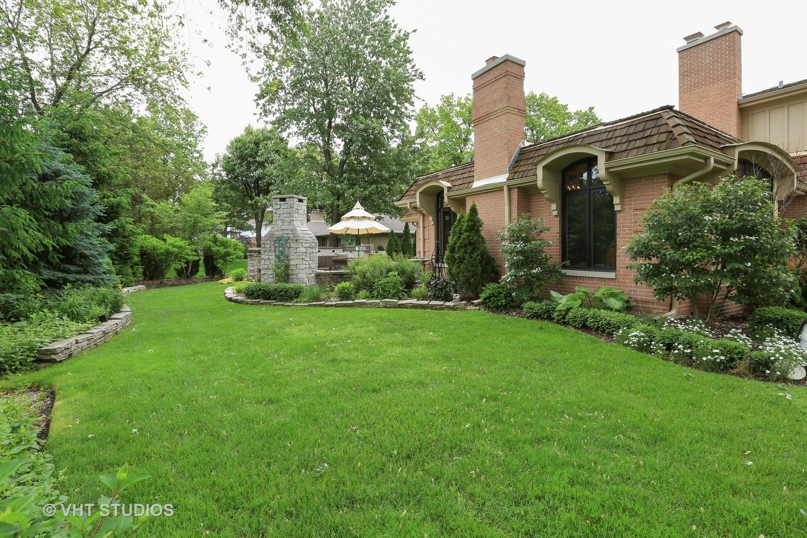 39 Mockingbird Lane Oak Brook, IL 60523 - Photo 3 of 45 a front view of a house with a yard