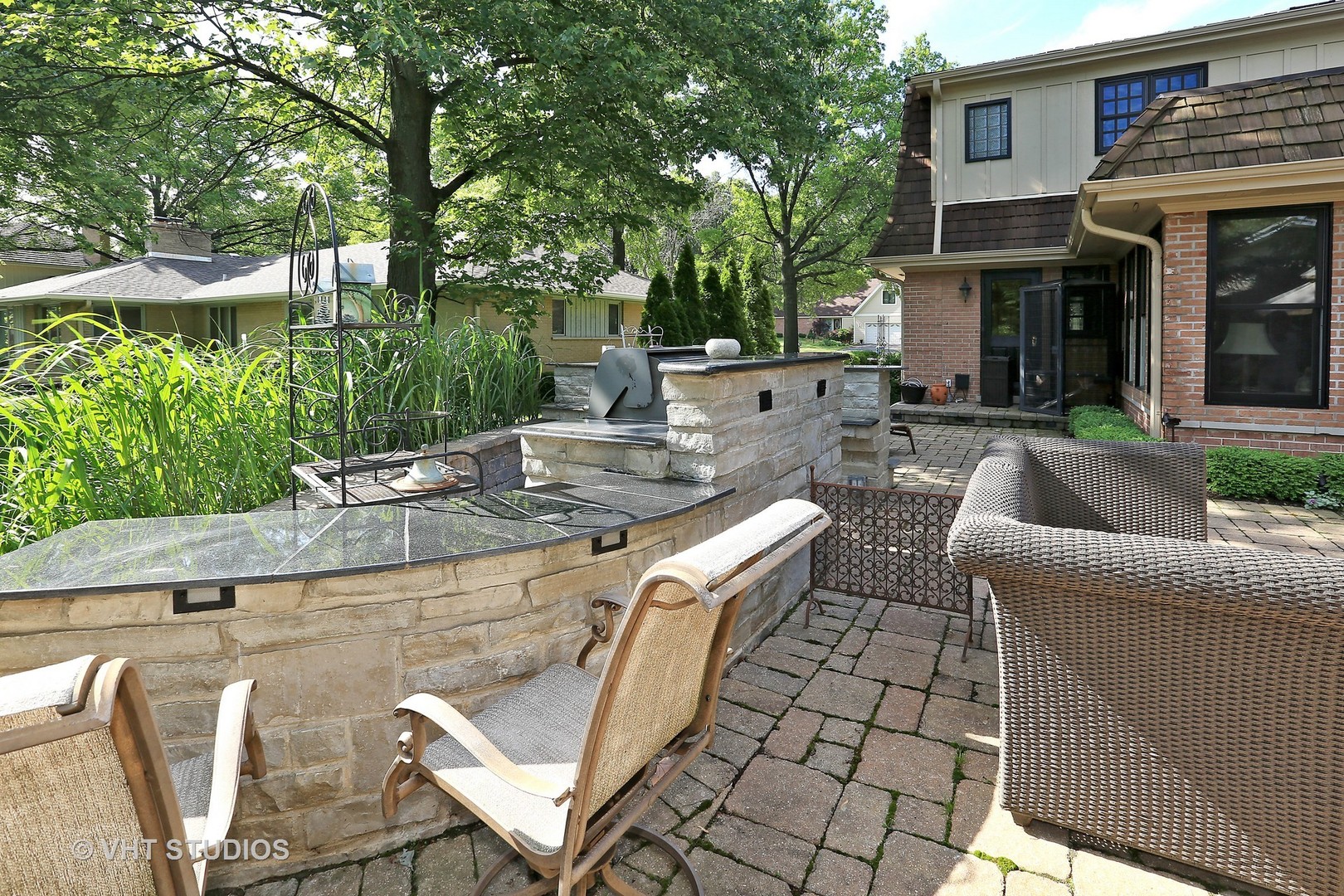 39 Mockingbird Lane Oak Brook, IL 60523 - Photo 35 of 45 a view of a patio with couches table and chairs and potted plants