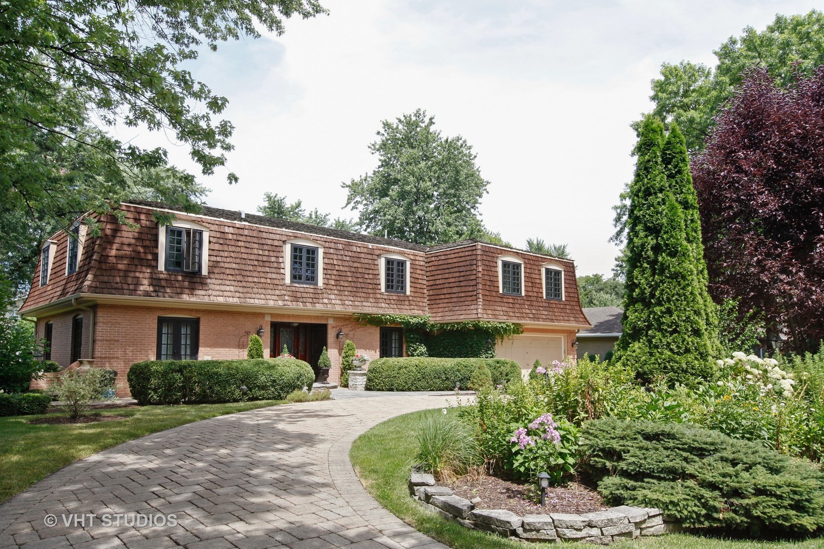 39 Mockingbird Lane Oak Brook, IL 60523 - Photo 36 of 45 a front view of a house with a yard