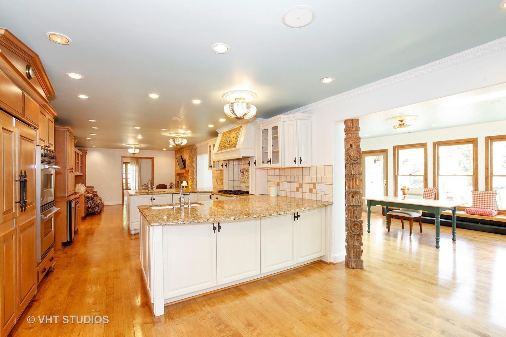 39 Mockingbird Lane Oak Brook, IL 60523 - Photo 43 of 45 a view of a kitchen with dining table chairs and living room