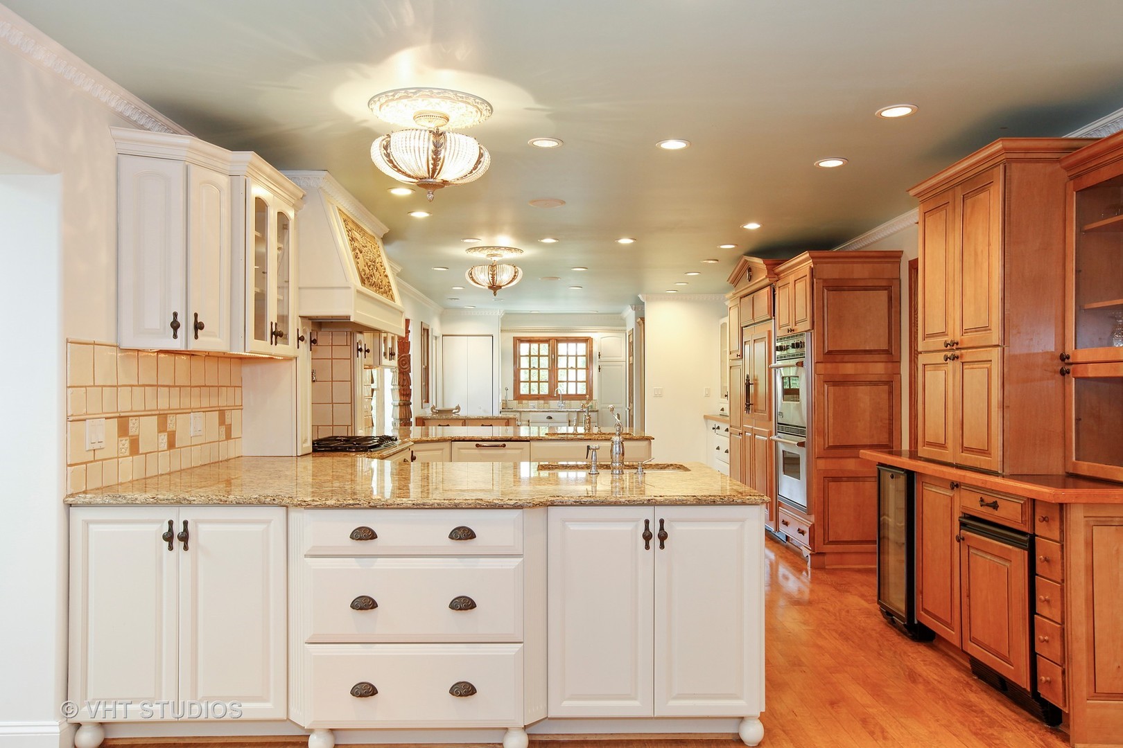 39 Mockingbird Lane Oak Brook, IL 60523 - Photo 44 of 45 a kitchen with kitchen island granite countertop a sink cabinets and stainless steel appliances