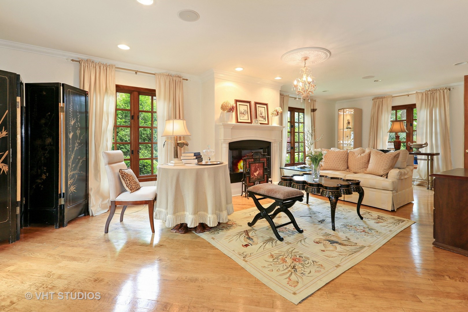39 Mockingbird Lane Oak Brook, IL 60523 - Photo 8 of 45 a living room with furniture a fireplace and a table