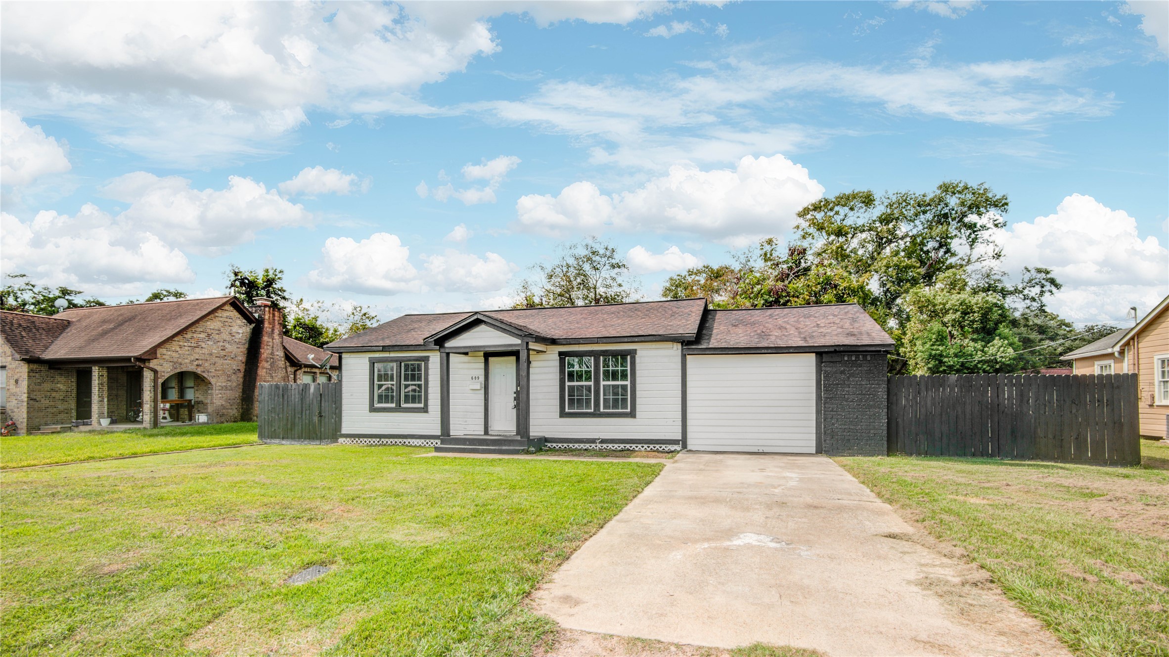 609 Hurst Place Angleton, TX 77515 - Photo 3 of 36 a front view of a house with garden