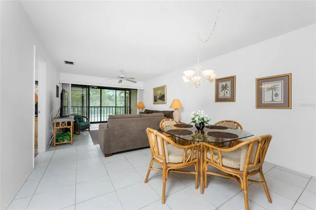 a view of a livingroom with furniture and a large window