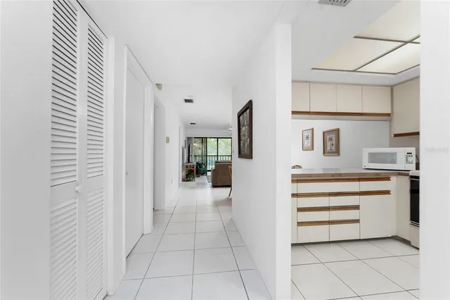 a view of entryway and kitchen