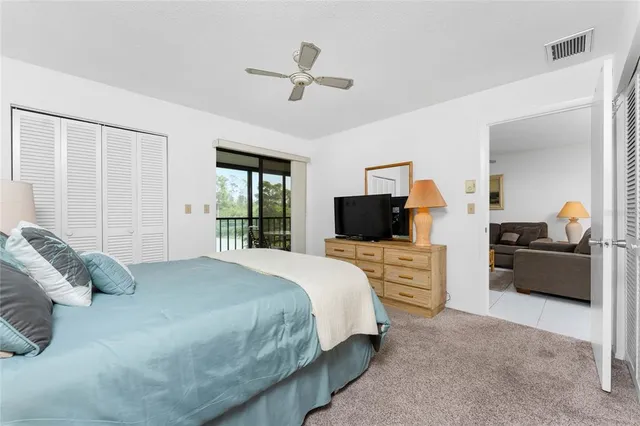 a bedroom with a bed and a television