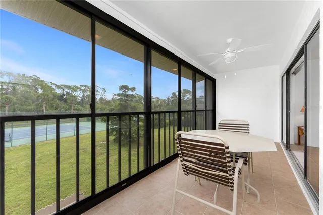 a view of a hallway with wooden floor and fence