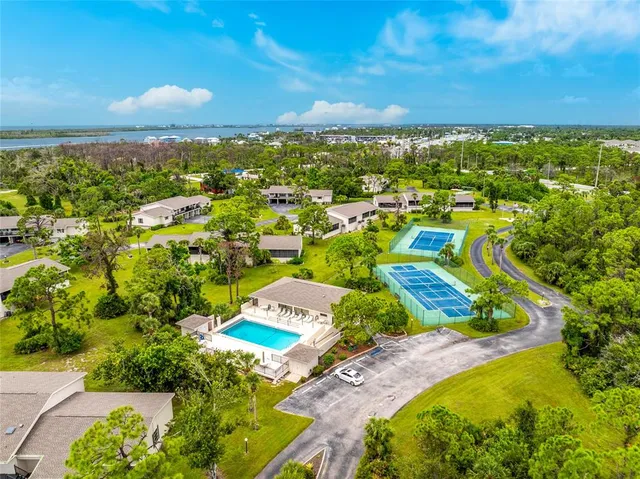 an aerial view of residential houses with outdoor space