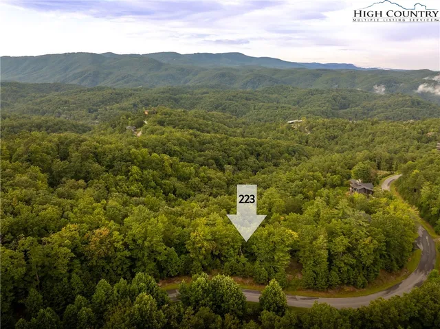 a view of a lake with mountains and valleys