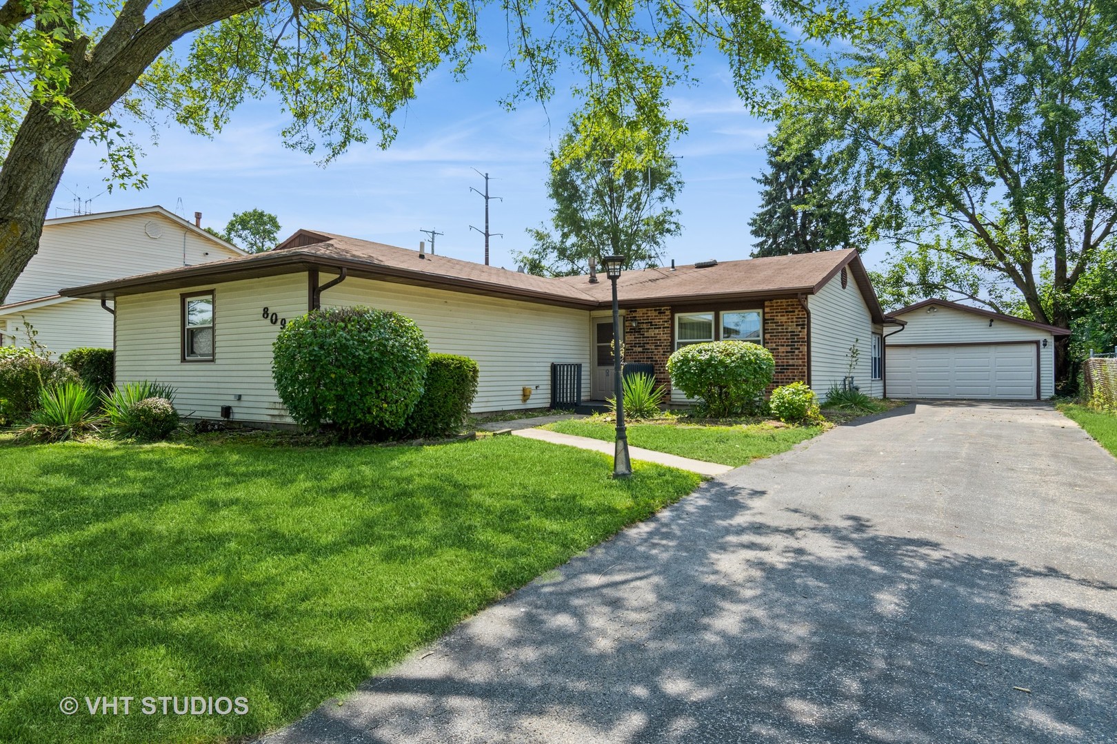 809 Oakton Avenue Romeoville, IL 60446 - Photo 1 of 23 a view of a house with a garden