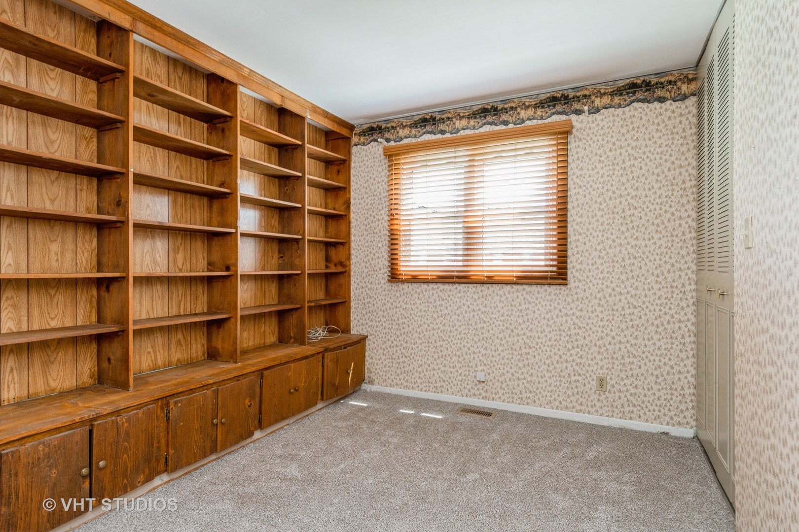 809 Oakton Avenue Romeoville, IL 60446 - Photo 15 of 23 a view of an empty room with shelves