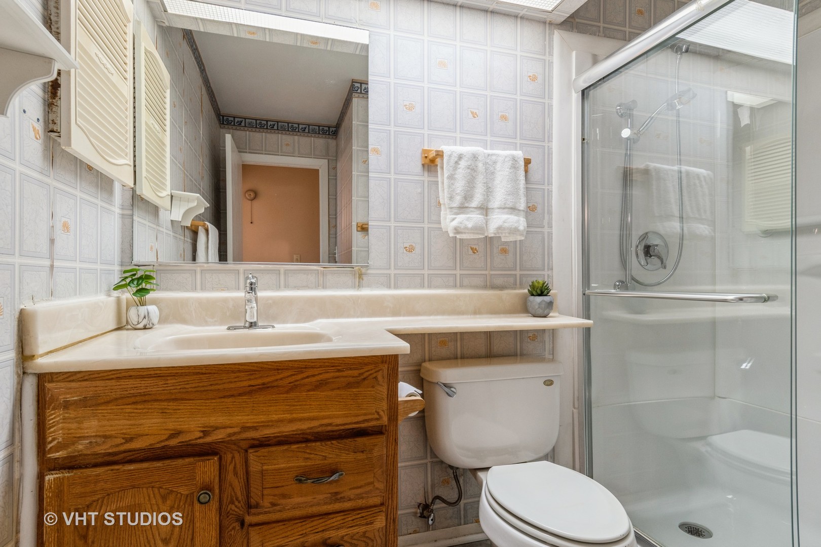 809 Oakton Avenue Romeoville, IL 60446 - Photo 16 of 23 a bathroom with a sink a toilet and shower