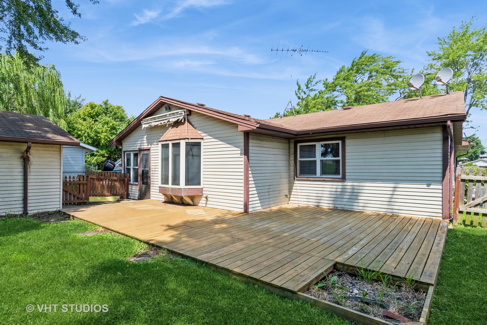 809 Oakton Avenue Romeoville, IL 60446 - Photo 19 of 23 a backyard of a house with wooden floor yard and outdoor seating