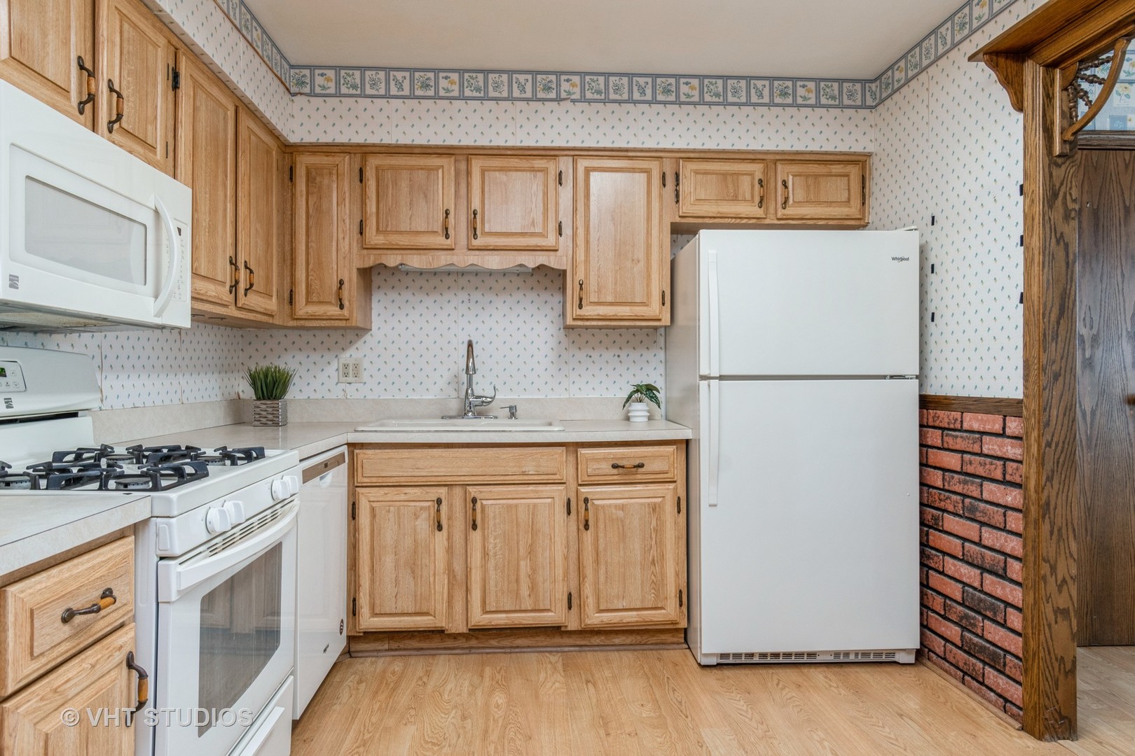 809 Oakton Avenue Romeoville, IL 60446 - Photo 4 of 23 a kitchen with stainless steel appliances granite countertop a refrigerator stove a sink and dishwasher with wooden floor