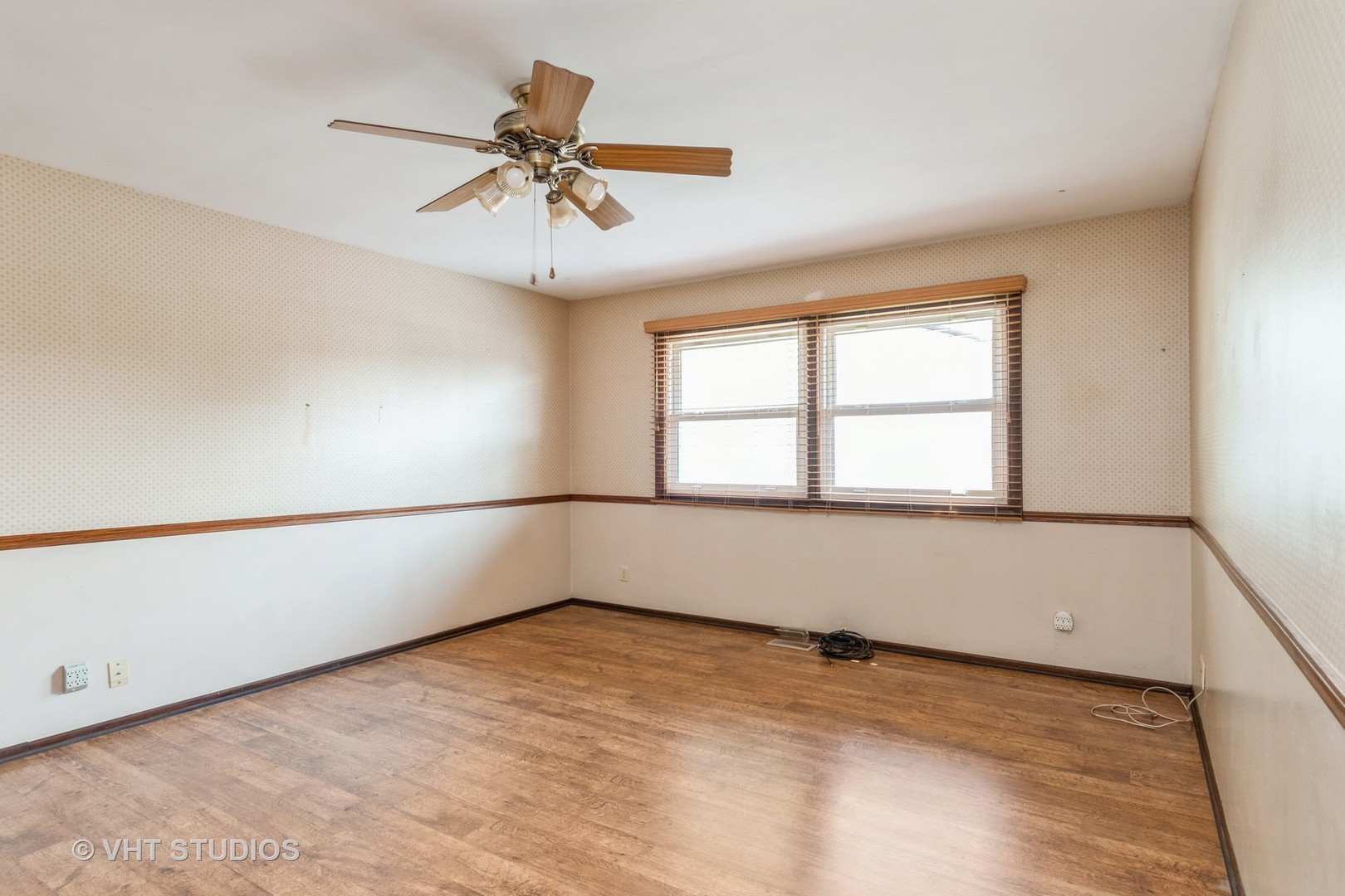 809 Oakton Avenue Romeoville, IL 60446 - Photo 9 of 23 wooden floor in an empty room with a window